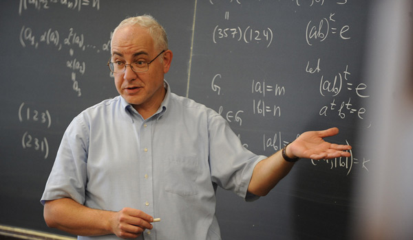A math professor at Catholic ҽ teaching a class.