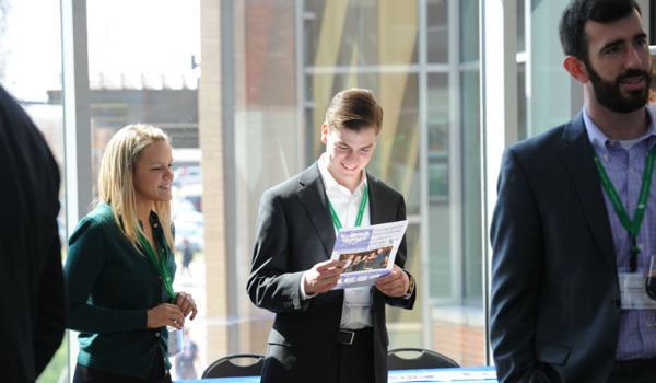 Catholic ҽ students at a professional networking event.