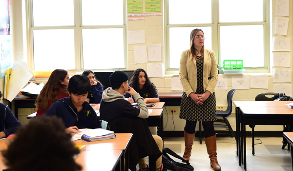 A Catholic ҽ student gaining hands-on experience teaching in a high school classroom.